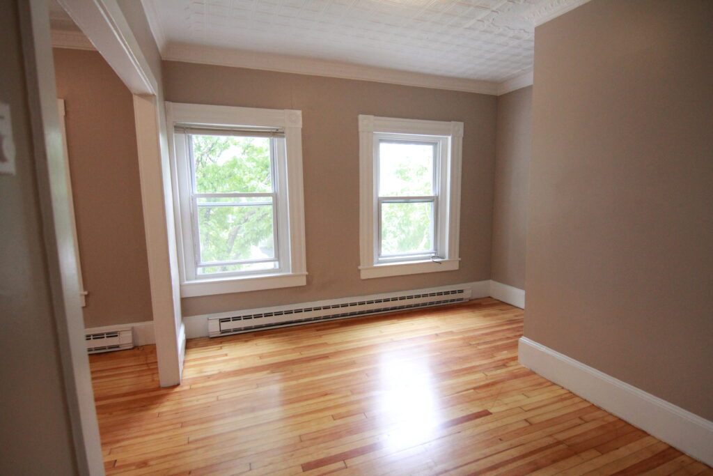 Baird Home Solutions - fresh paint molding and floors for this small apartment